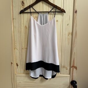 Ladies high low spaghetti strap shirt,

BUNDLE PURCHASE MORE & SAVE ON SHIPPING!